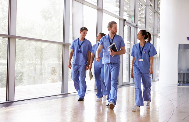 A group of nurses walking together.